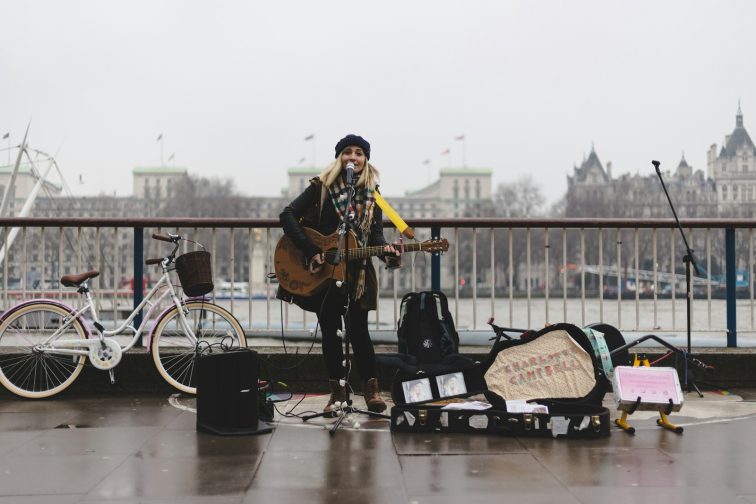 woman playing guitar The Rise of Independent Artists